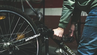 a close up of a person holding a bike