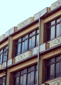 Wide shot of a building exterior featuring fasart’s decorative window profiles.