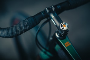 Close-up of a sleek bike handlebar grip with the agri logo