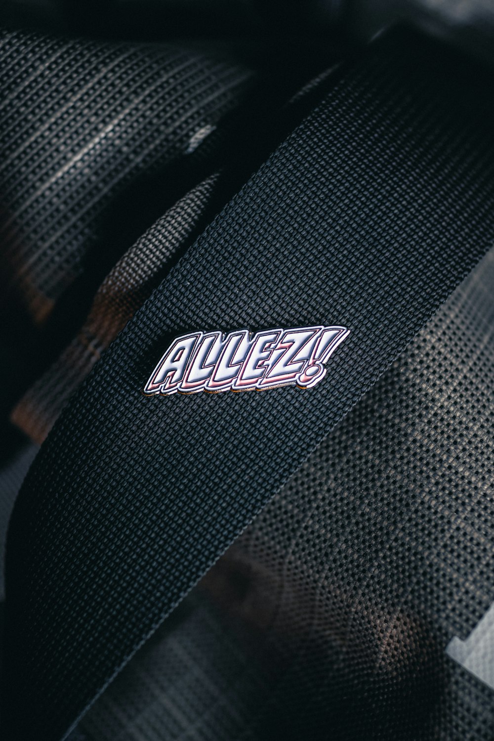 a close up of a tie with a name on it