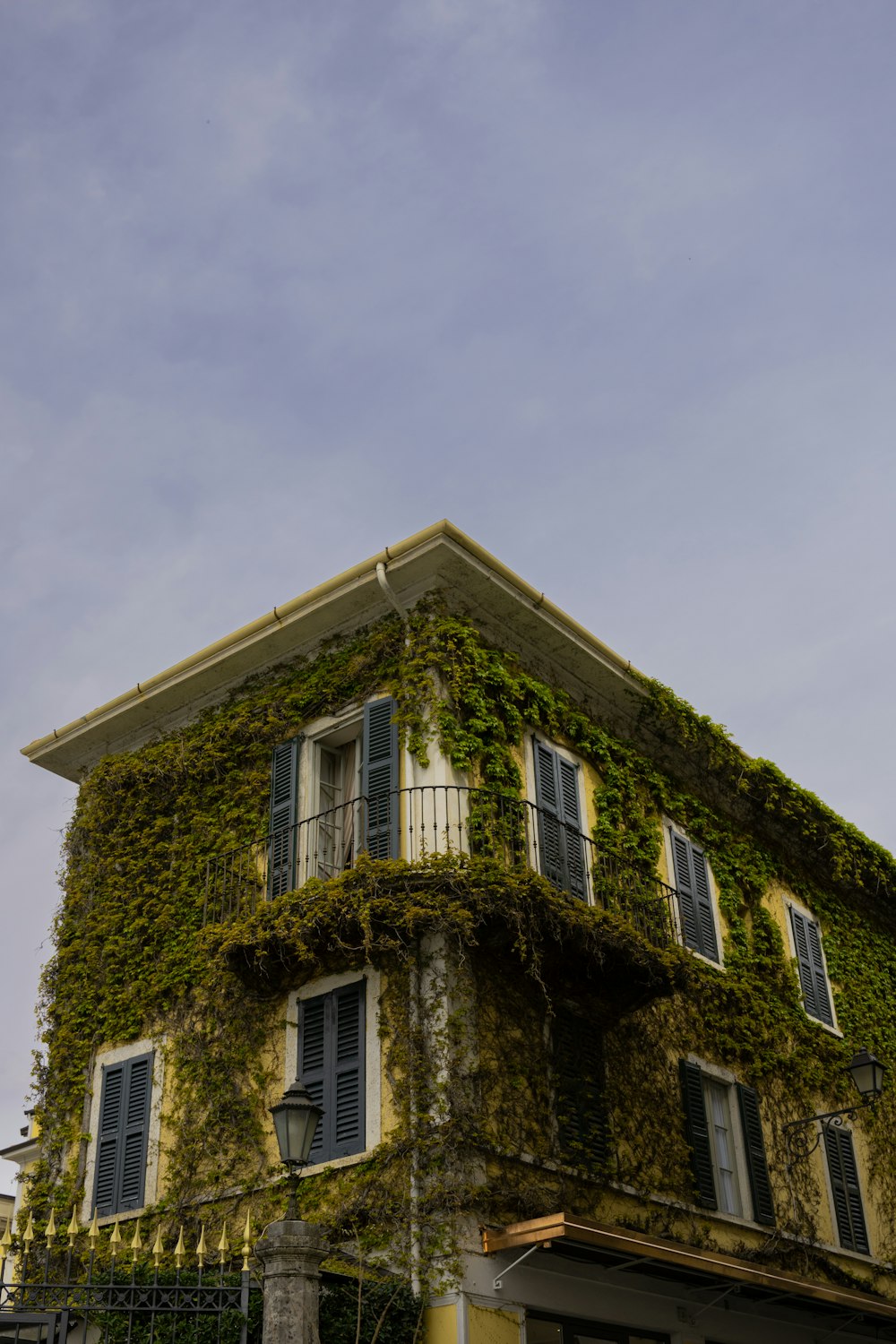 an old building covered in vines and vines