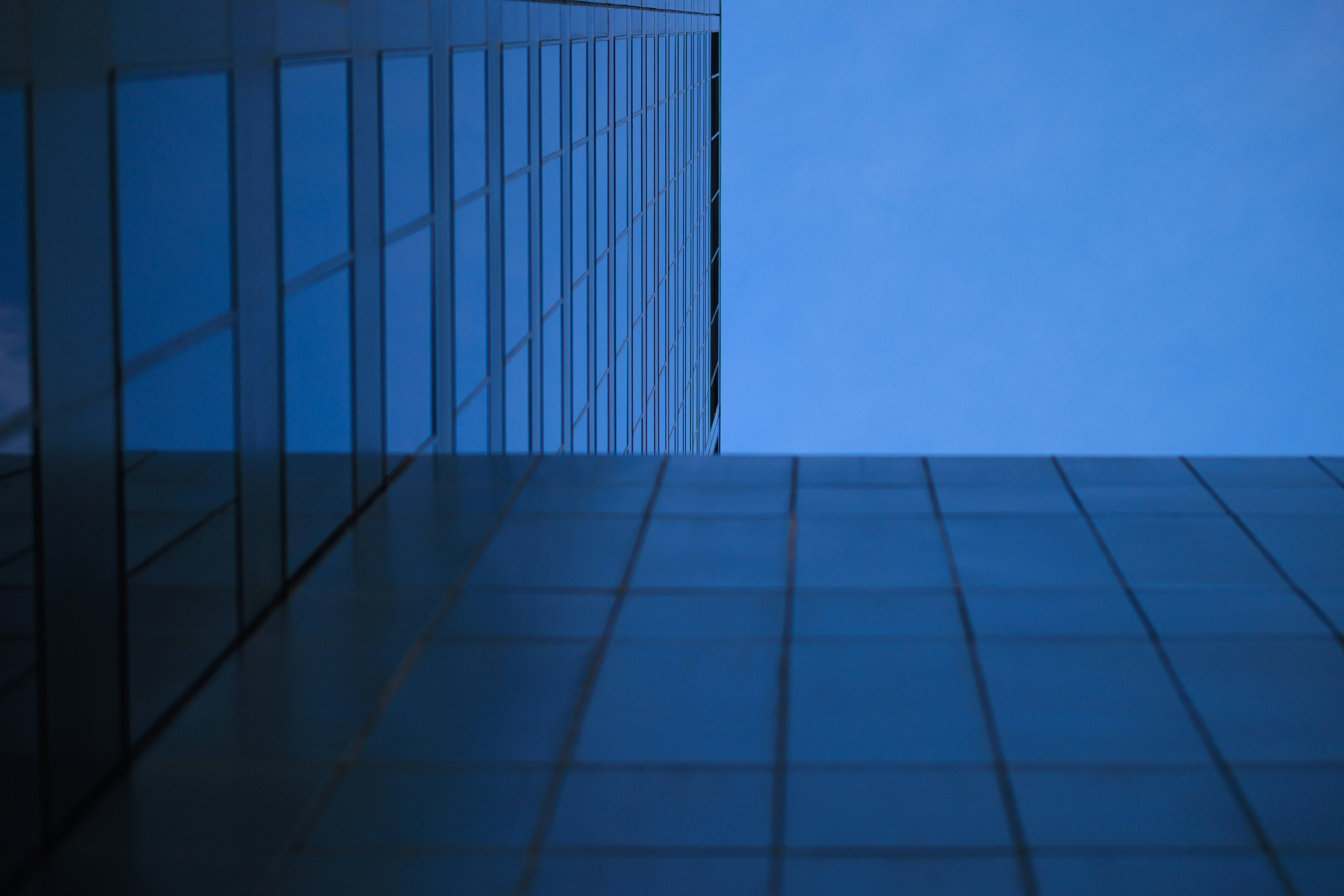 a tall building with a blue sky in the background