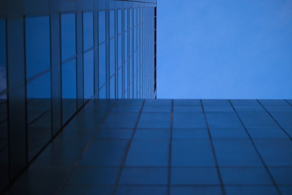 a tall building with a blue sky in the background