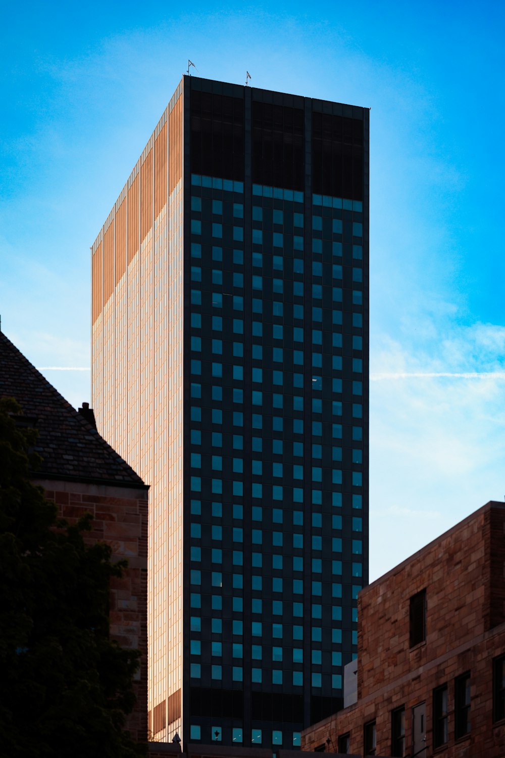 a very tall building with a clock on it's side