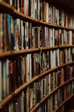 Bookshelves filled with legal publications in a cozy, well-lit library setting.