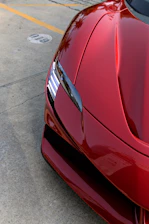 A shiny car parked on a sunny Palm Beach street after a basic detail.