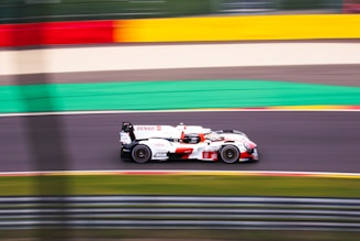 A racing car speeding on a track.