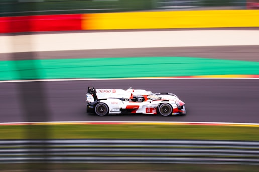 A racing car speeding on a track.