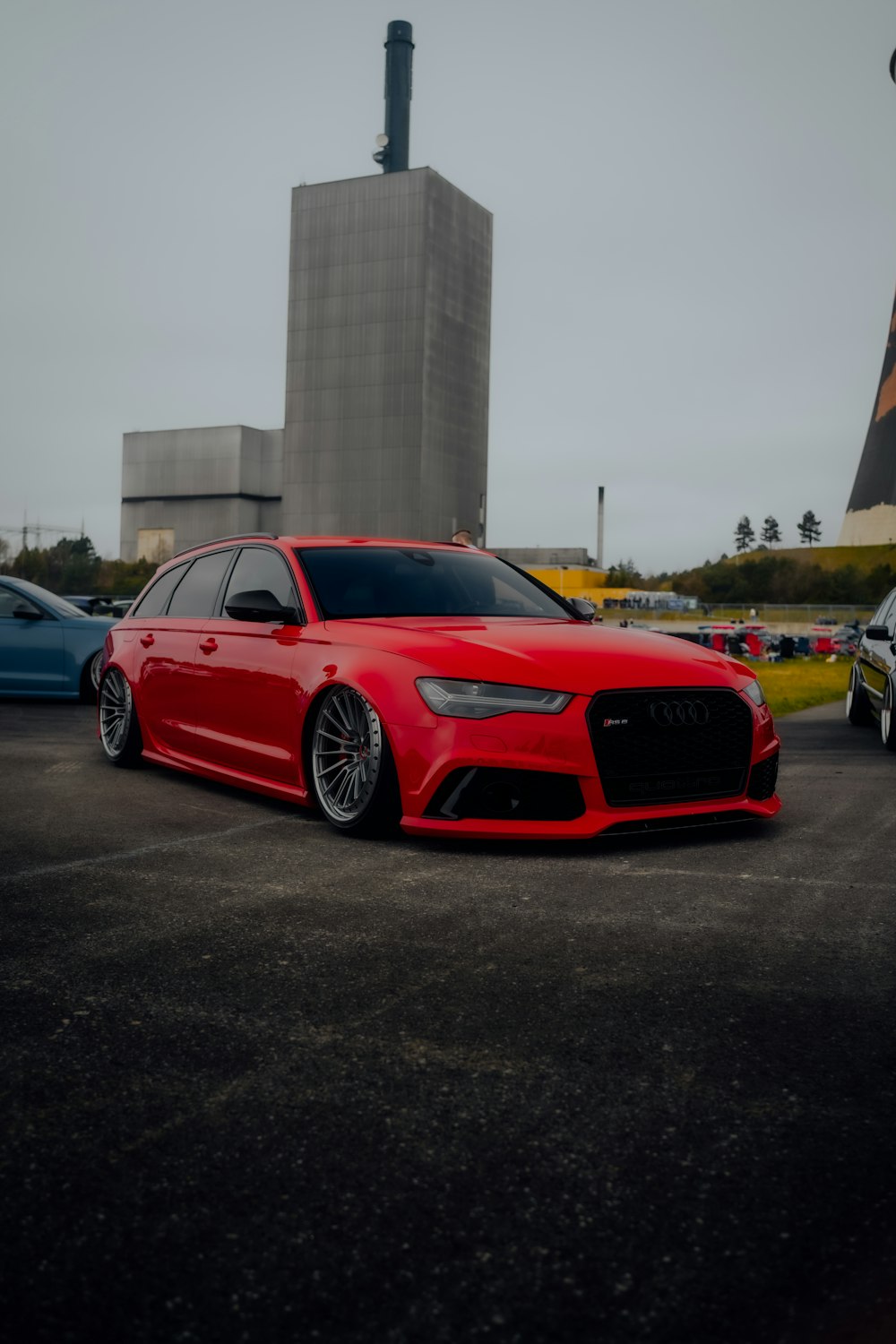 a red car parked in a parking lot