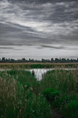 A person reflecting in a serene environment, symbolizing personal growth and transformation.
