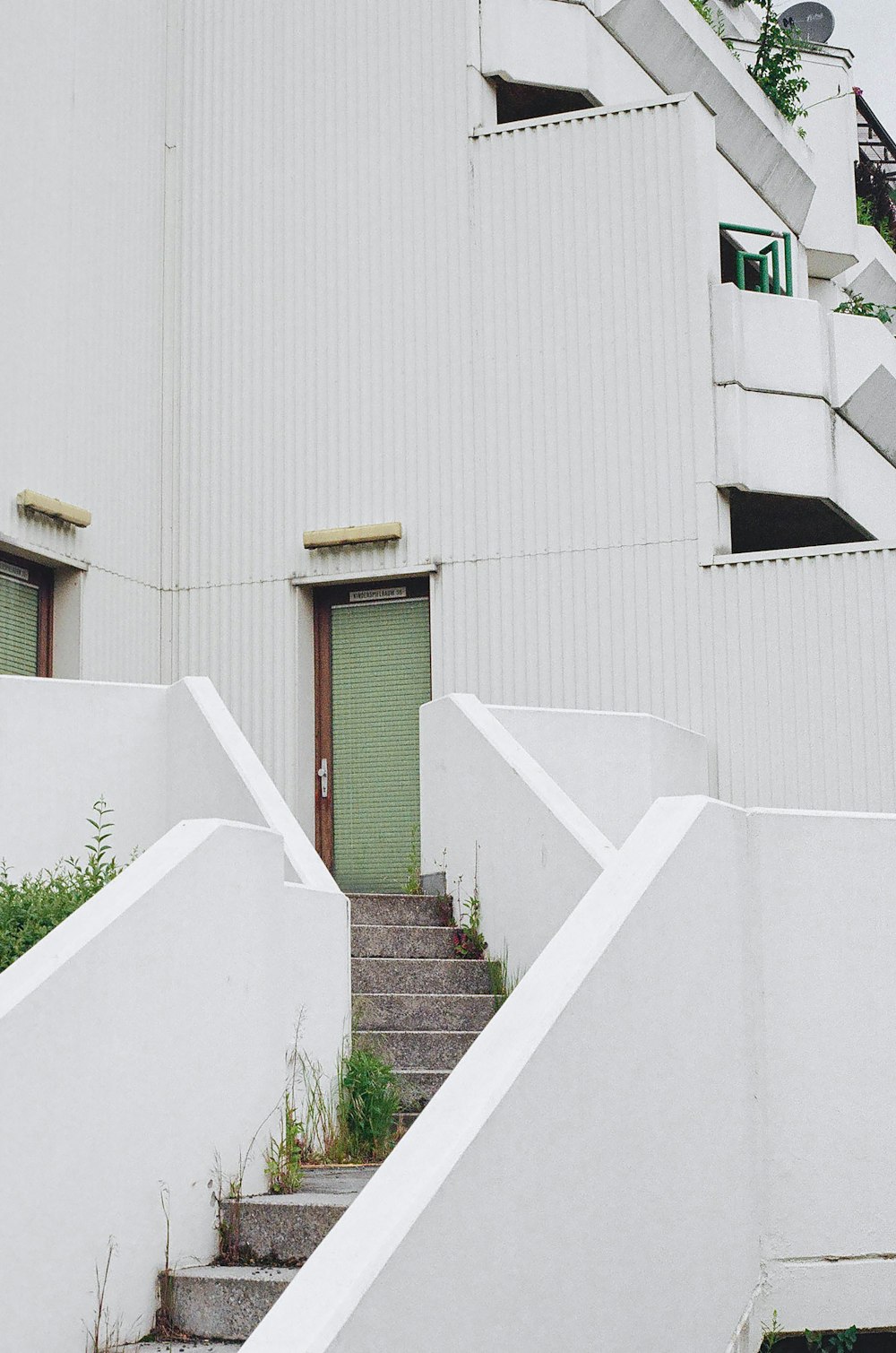 a white building with stairs leading up to it