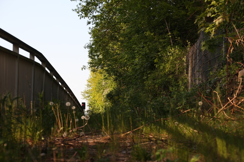 a train track with a bridge in the background