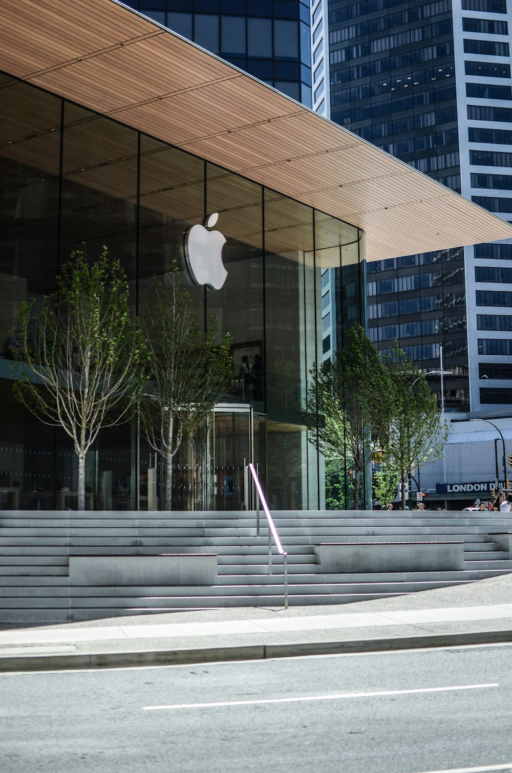 an apple store with stairs leading up to it