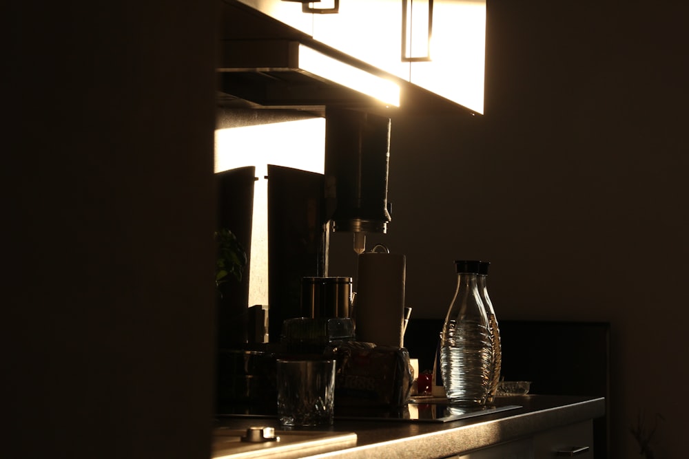 a light shines through a window onto a dresser