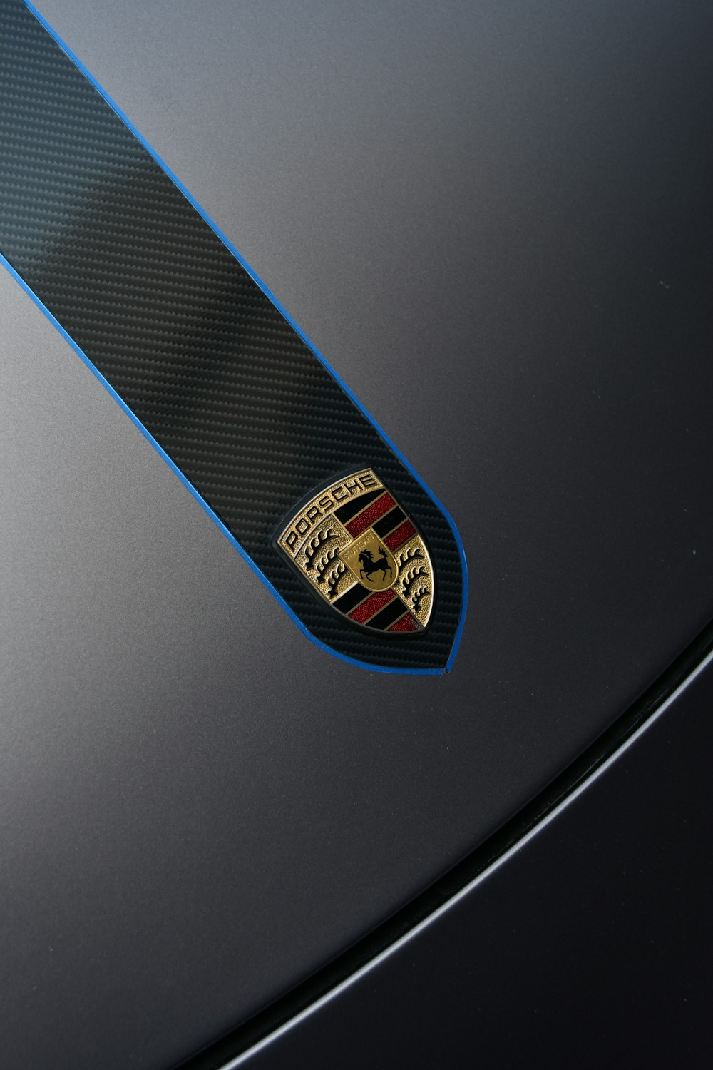 a close up of the emblem on a sports car