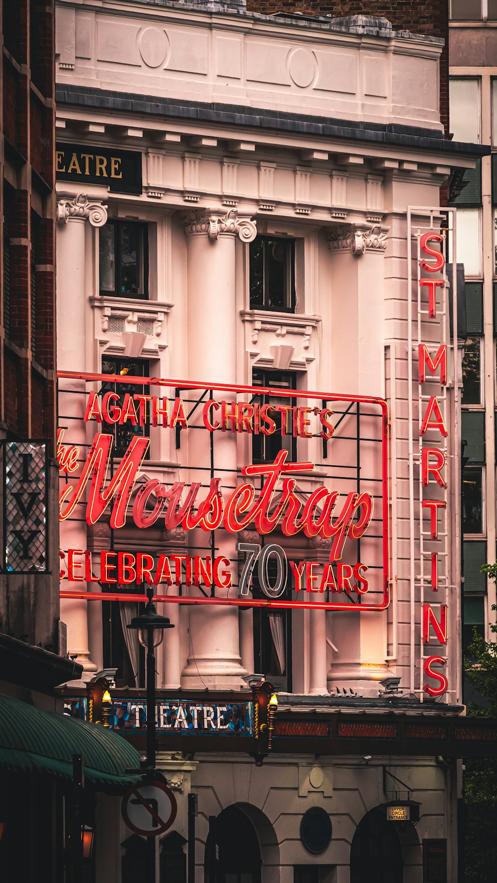 a large neon sign on the side of a building