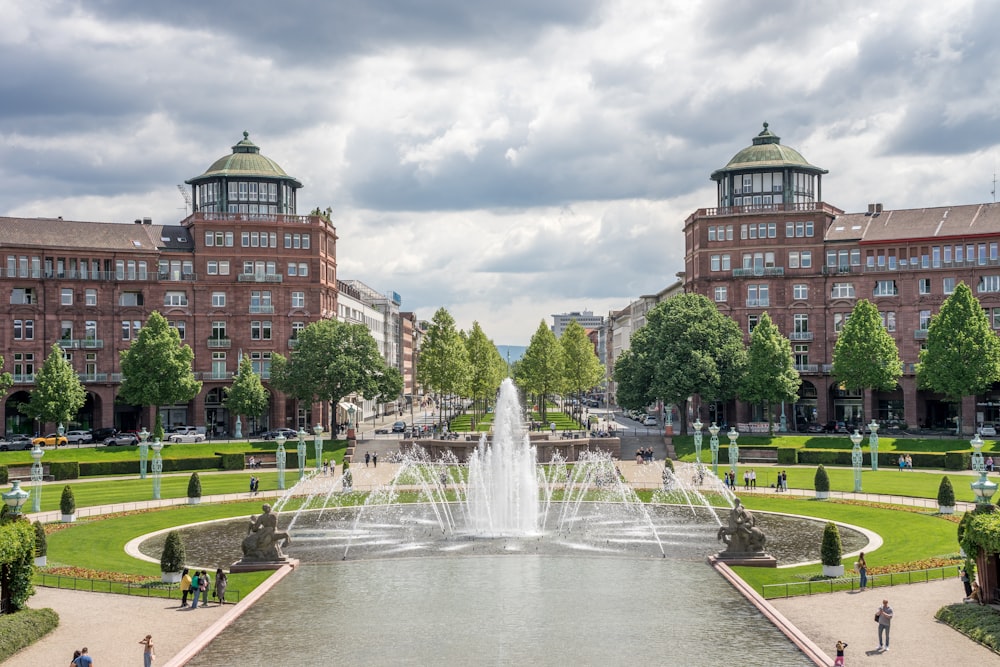 a view of a fountain in the middle of a park