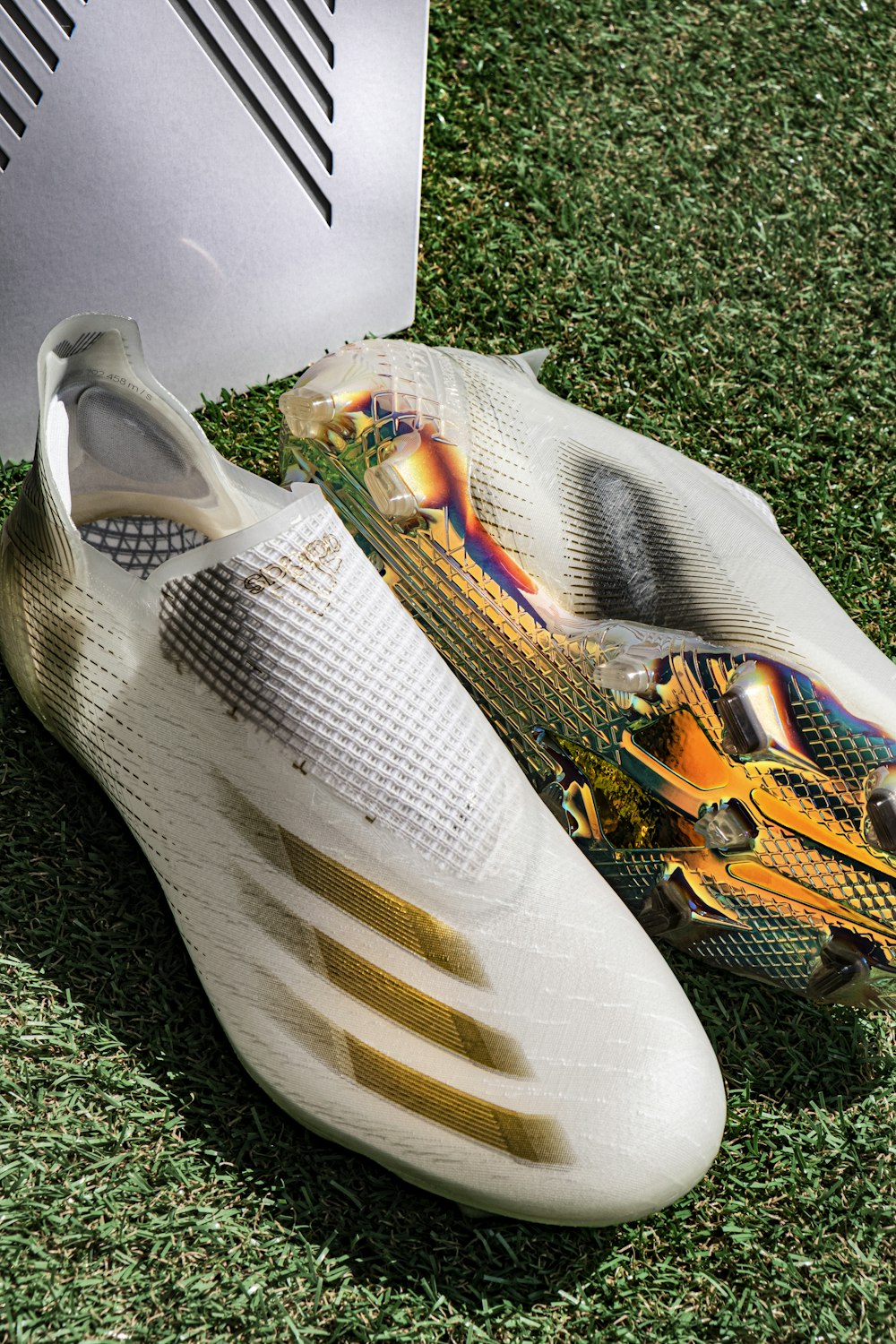 a close up of a pair of shoes on the grass