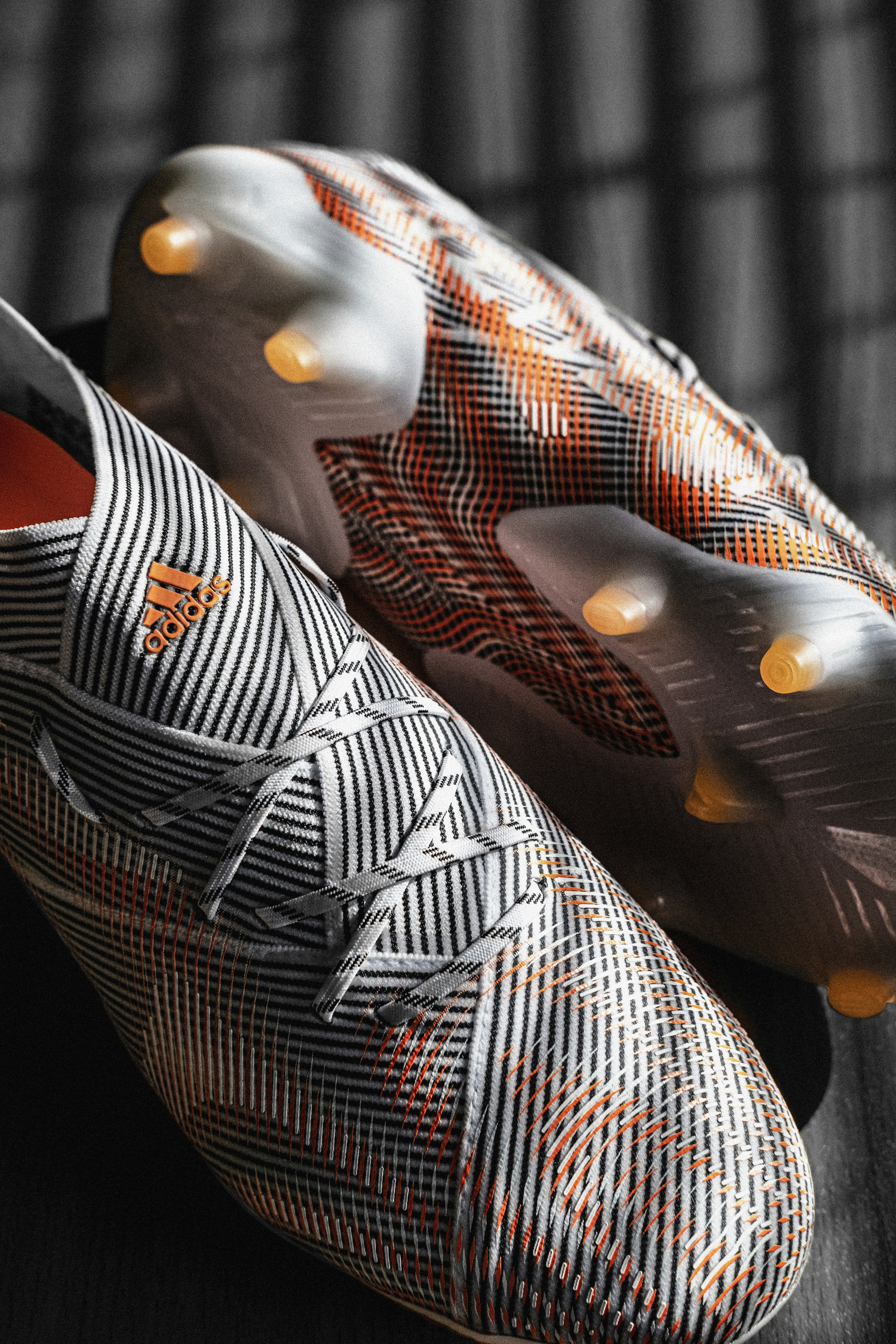 a close up of a pair of soccer shoes