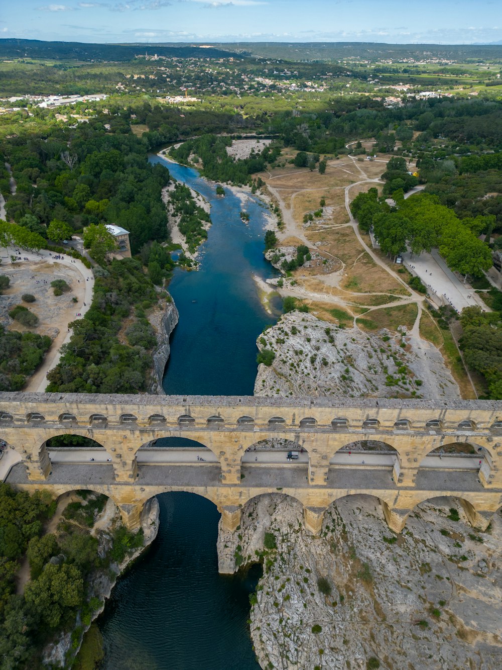 an aerial view of a bridge over a river