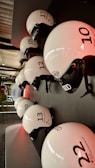 A group of safety helmets in various colors arranged neatly.