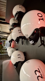 Close-up of durable firefighter helmets and gloves arranged neatly on a wooden table.