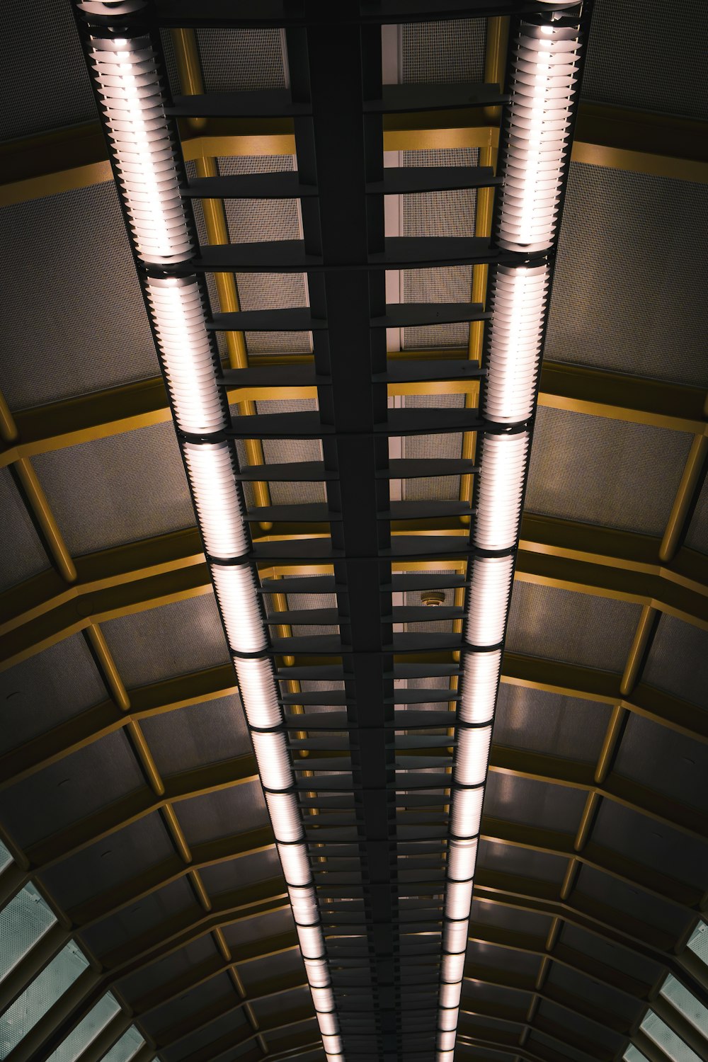 the ceiling of a train station is lit up