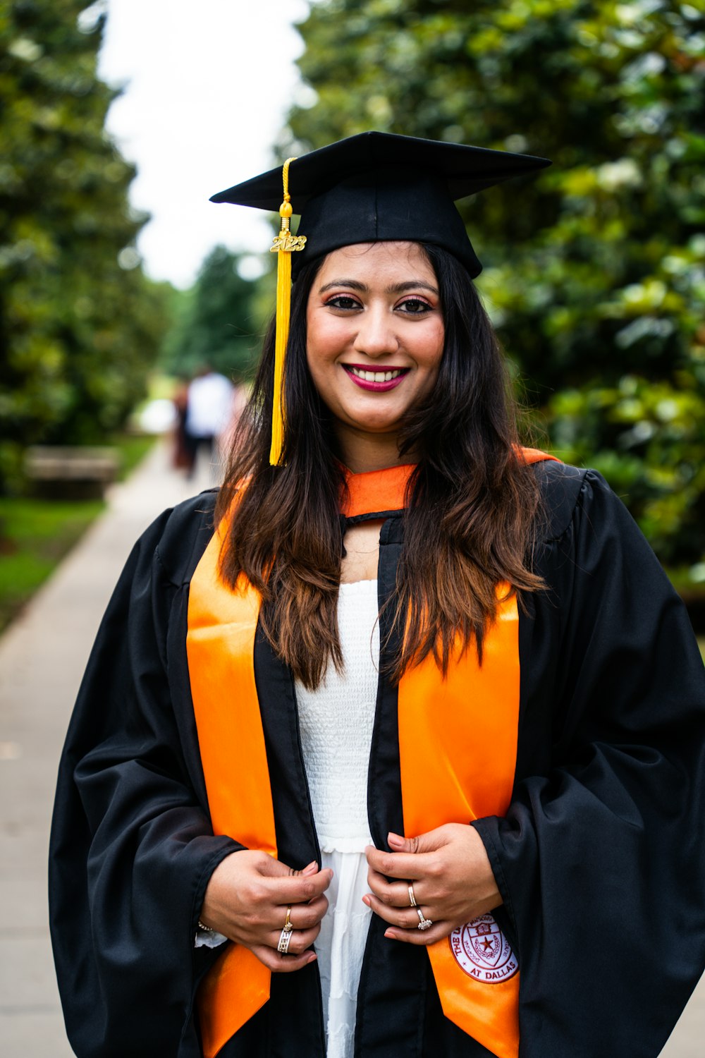 a woman in a graduation cap and gown