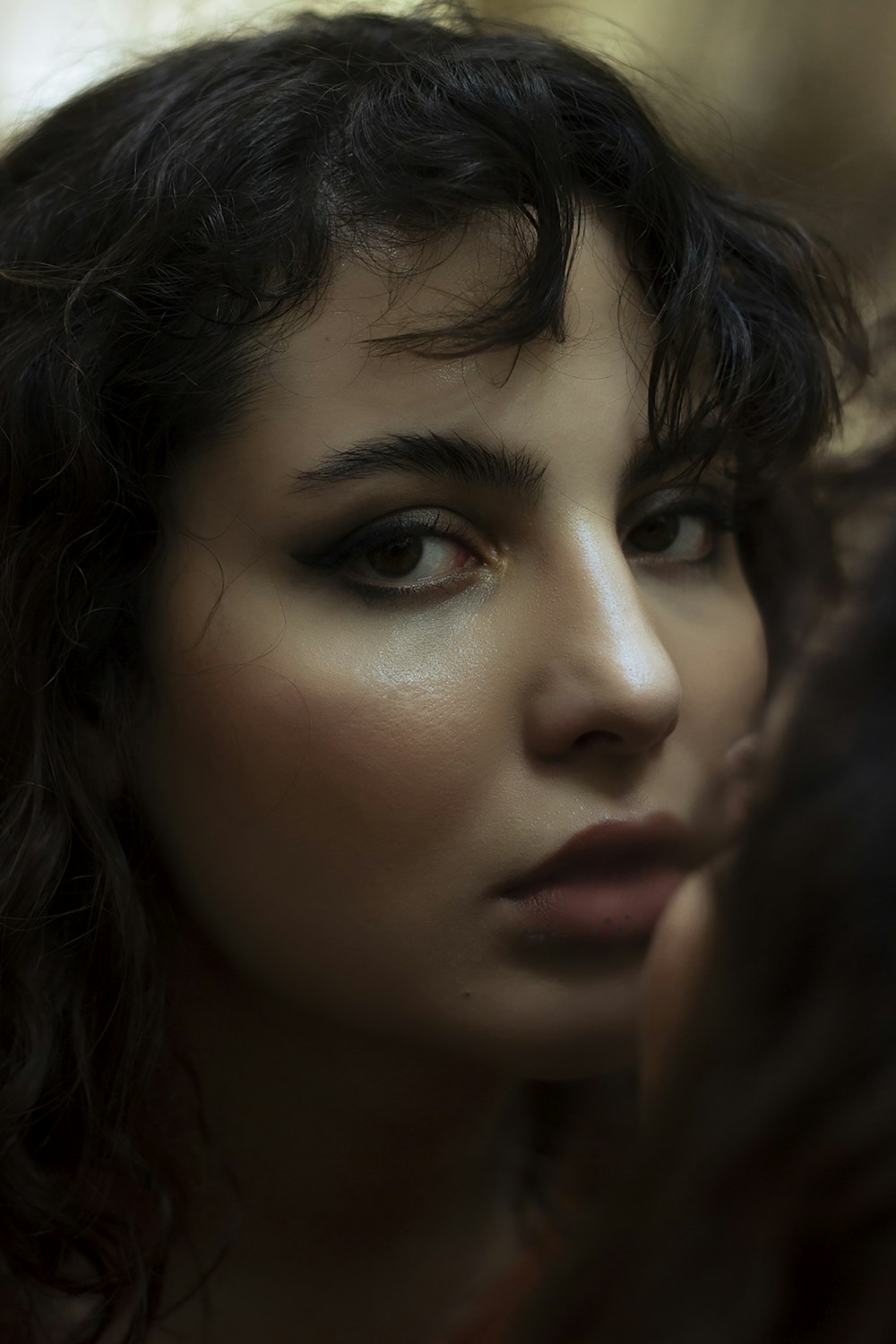 a close up of a person with dark hair