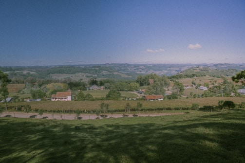 Panoramic view of a peaceful rural site with rolling hills and trees
