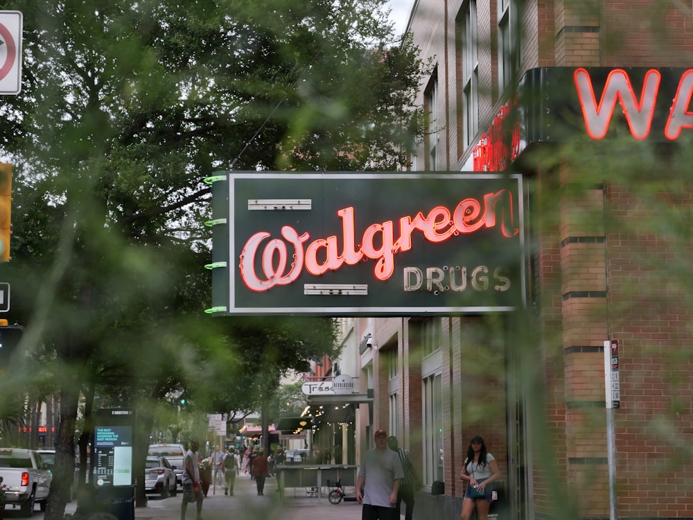a street sign that says walgreet drugs on it