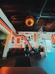 Stylish social party with modern black and gold decor and lively atmosphere.