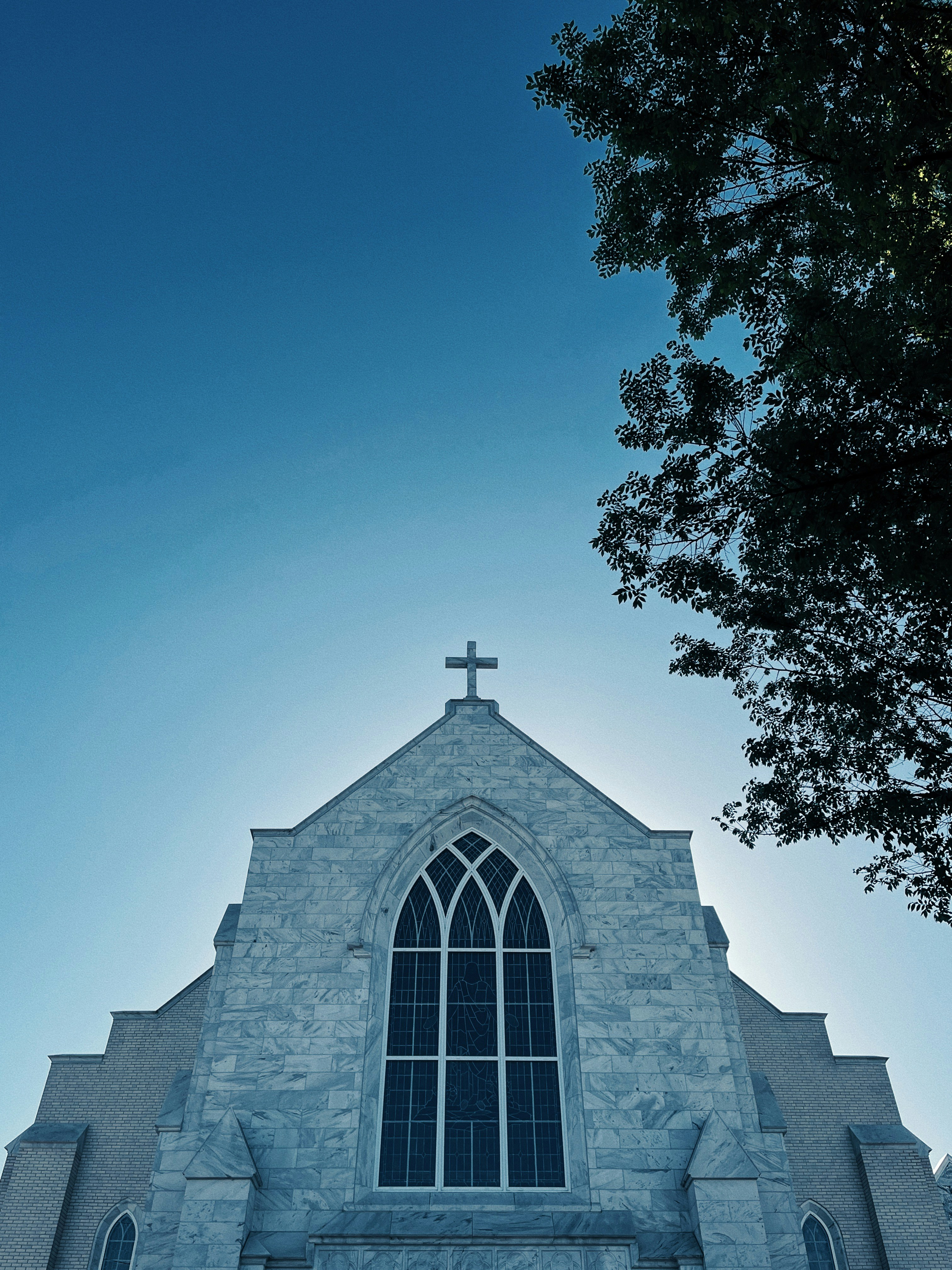 a church with a cross on the top of it