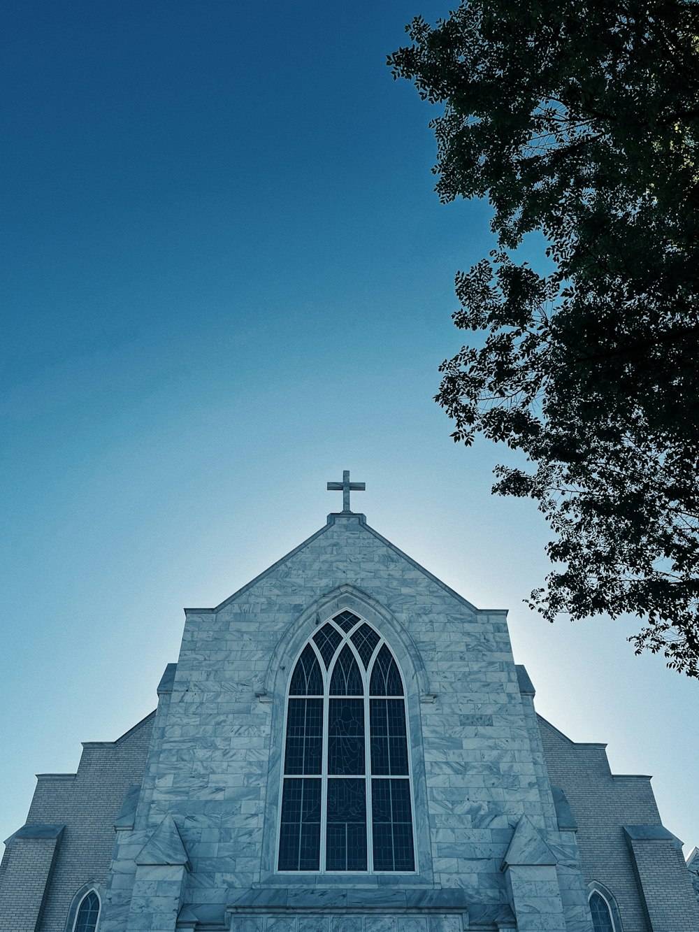 a church with a cross on the top of it