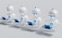 Four small, white robot figures are sitting in a row, each with a laptop in front of them. They have round bodies and blue accents, with 'AI' displayed on their chests. The background is minimal and light gray, emphasizing the robots and their computers.