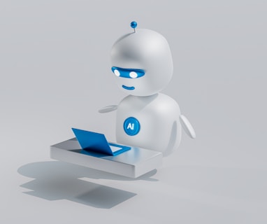 a white robot with blue eyes and a laptop