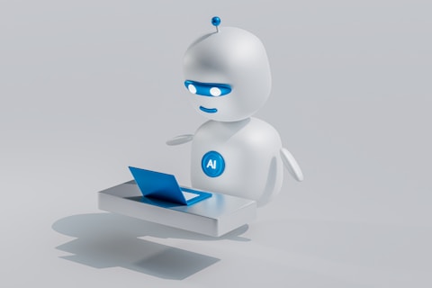 a white robot with blue eyes and a laptop