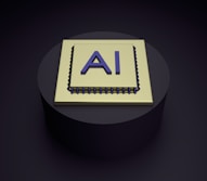 A 3D rendering of a microchip with the letters 'AI' prominently displayed on its surface, set on a dark, circular platform.