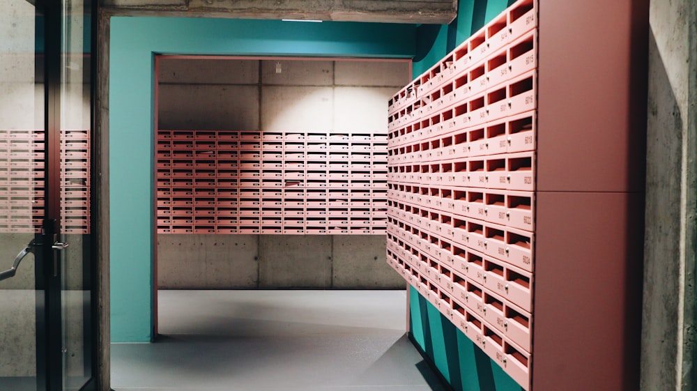 a room filled with lots of pink and blue boxes