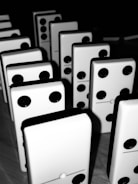 A dynamic domino tournament scene with players intensely focused around a wooden table.