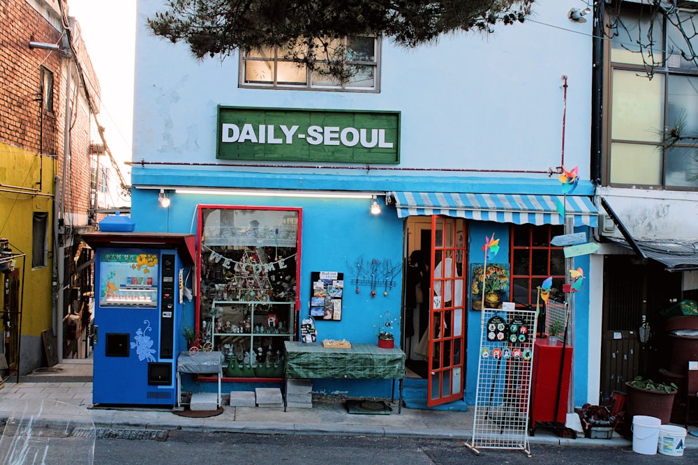 a store front with a vending machine in front of it