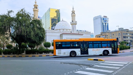 A modern Demiroğlu Seyahat service vehicle parked in front of a cityscape.