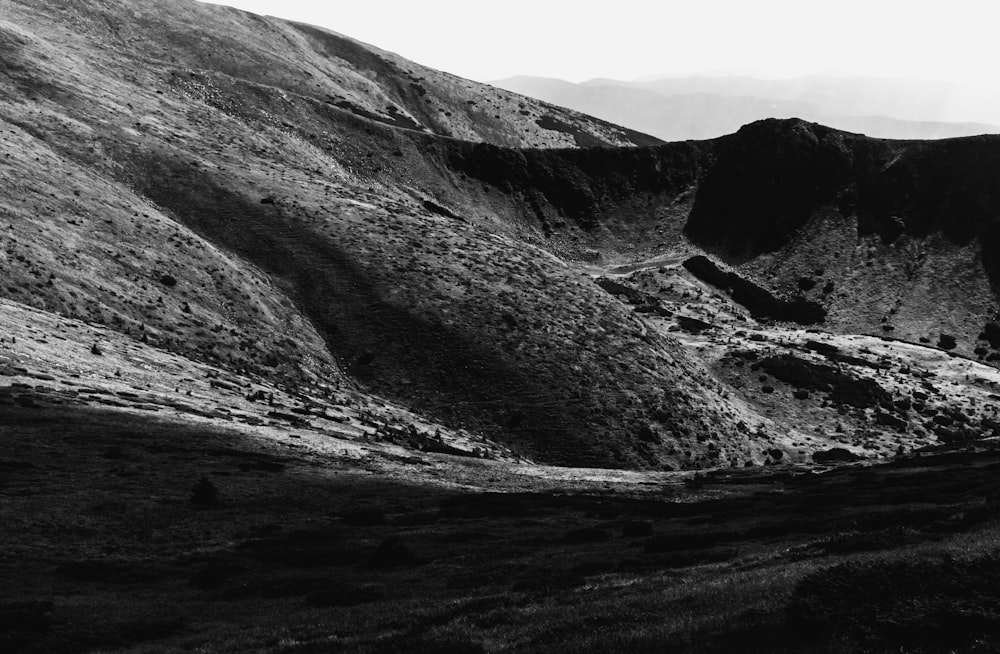 a black and white photo of a mountain range