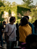 aivibe ambassador sharing insights during a casual outdoor meetup surrounded by greenery.