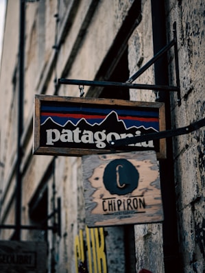 a sign hanging from the side of a building