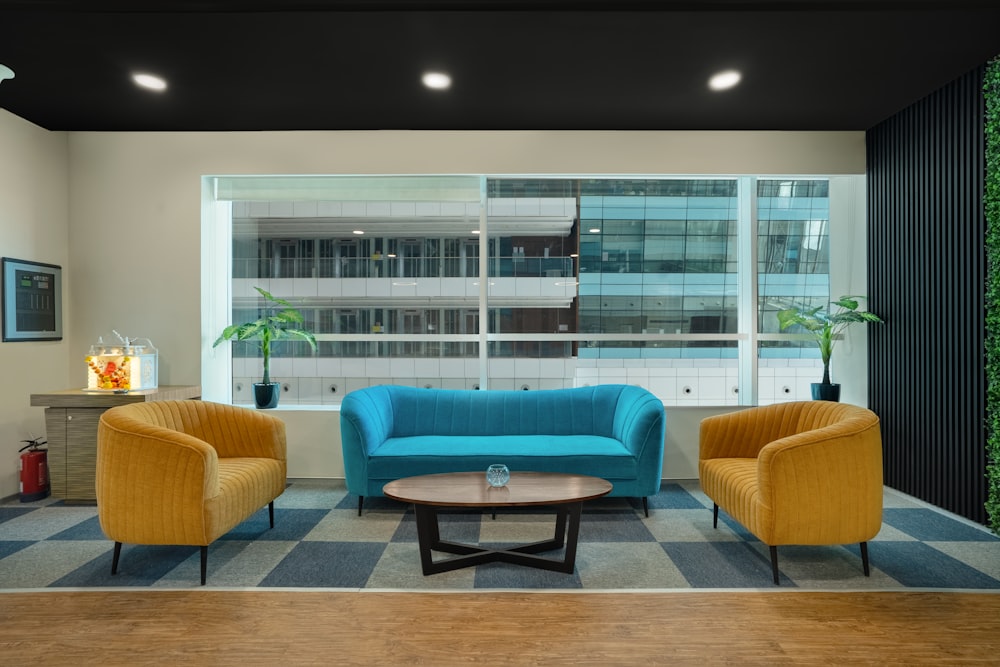 a living room filled with furniture next to a window