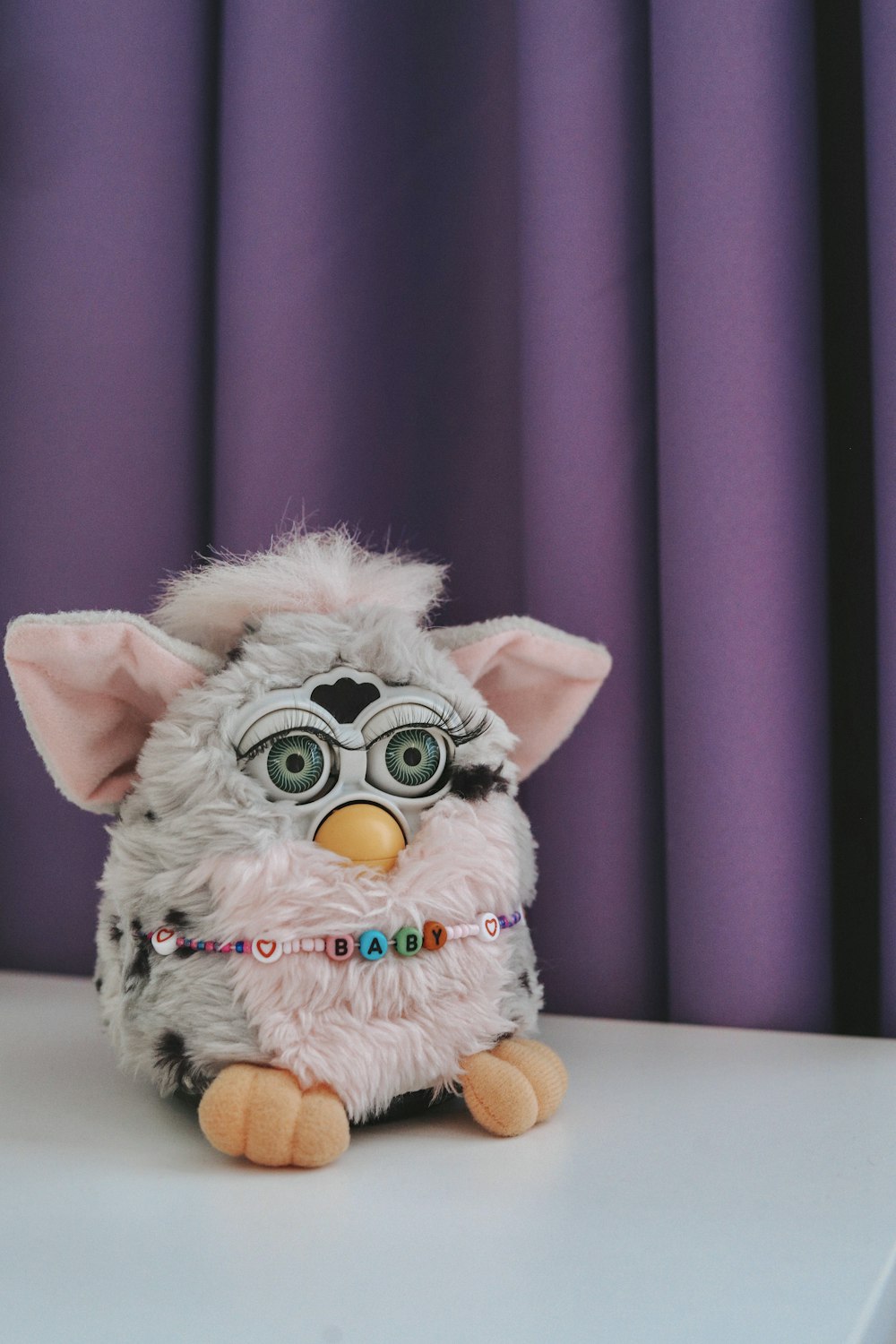 a stuffed animal is sitting on a table