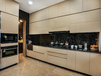 a kitchen with a stove, oven and microwave