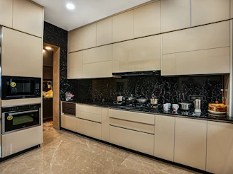 a kitchen with a stove, oven and microwave
