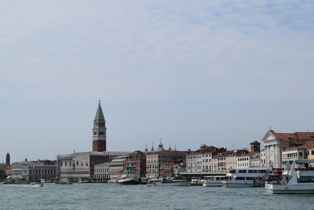 a large body of water with a clock tower in the background